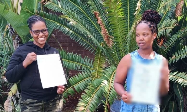 Two New Hope shareholders holding share certificates