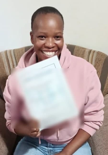 Nokukhanya Shabalala holding a New Hope share certificate
